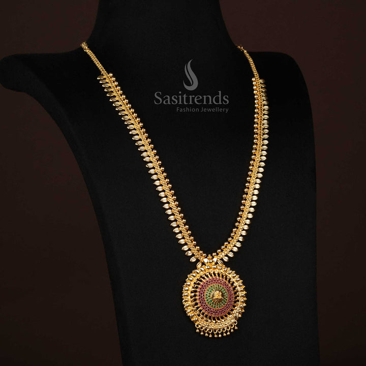 Ruby-green long Lakshmi haram necklace with traditional leaf-adorned pendant, micro gold finish and embedded AD stones – A heritage-inspired festive jewellery piece for grandeur looks – Sasitrends