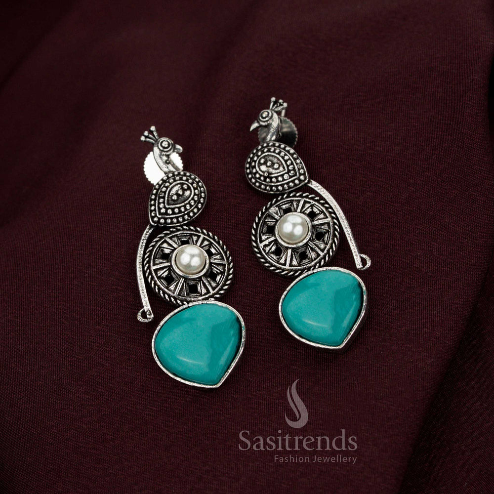 Celestial turquoise blue oxidised peacock earrings embellished with radiant pearl drops created for heritage refinement noble Navarathri elegance and divine jewellery grandeur – Sasitrends