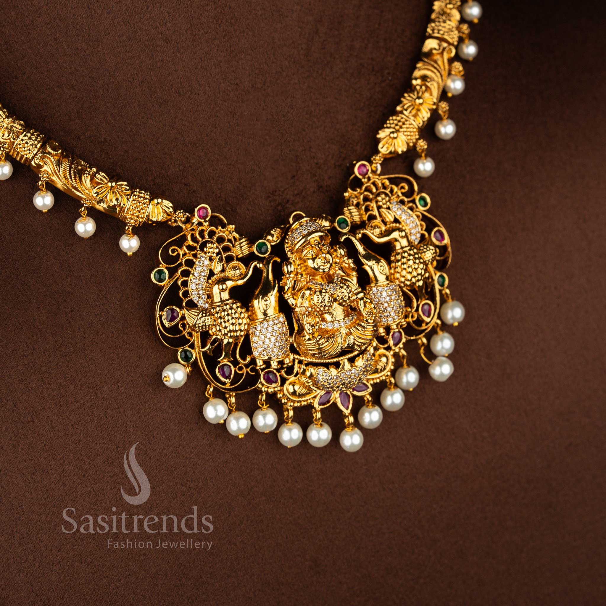 Regal legacy divine ornament collection portraying sacred Lakshmi imagery with peacock inspired craftsmanship elevated by multi tone stone arrangement – Sasitrends