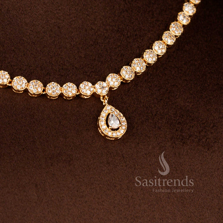 Radiant micro gold plated American Diamond round halo necklace in white shimmer paired with a graceful teardrop pendant and matching earrings finished with 24 carat gold polish – Sasitrends