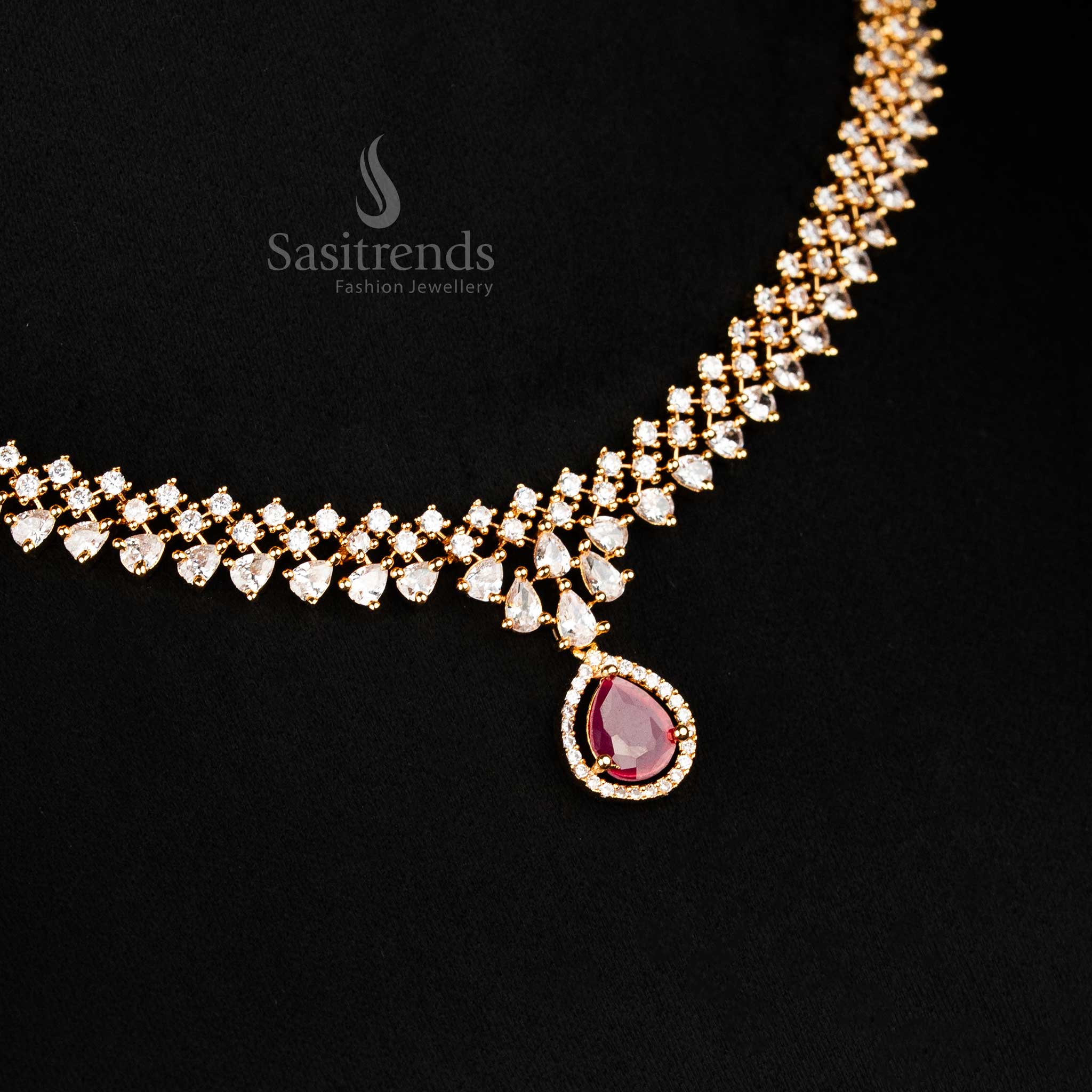 Layered chain AD necklace in white-ruby tones with central ruby-style drop and intricate micro gold polish, wedding jewellery from sasitrends