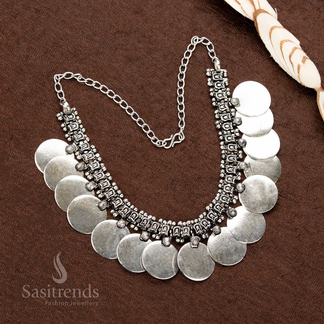 Statement oxidised silver choker necklace set adorned with handcrafted floral patterns, traditional domed discs, and exquisite ballwork, an elegant pick for celebratory dressing - Sasitrends