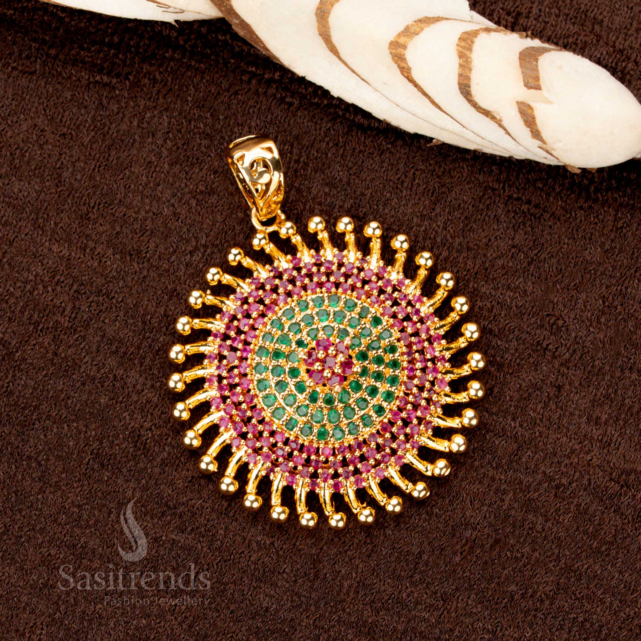 Elegant one-gram gold plated Chakara pendant, radiantly crafted with ruby-green stones, a luxurious festive jewellery piece