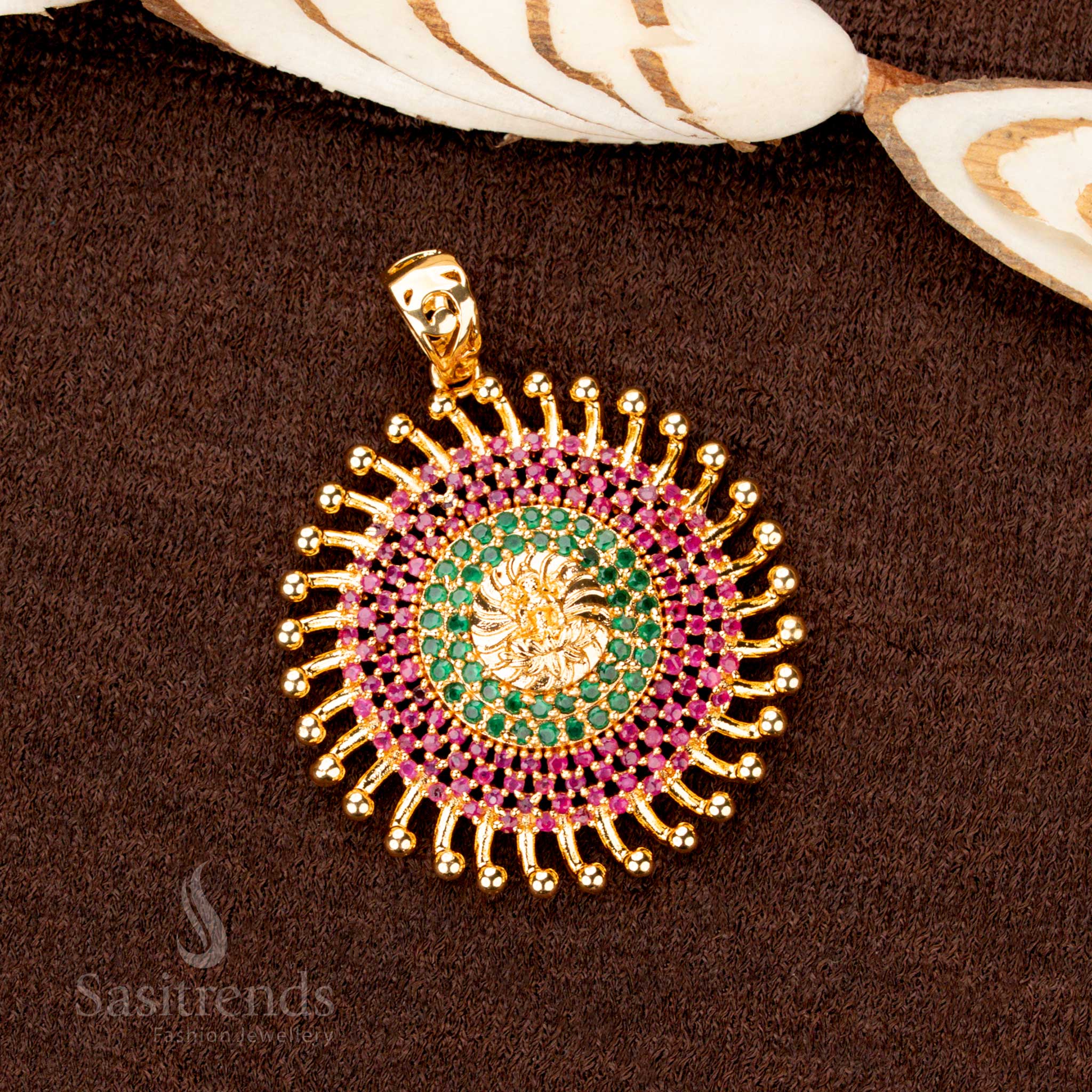 Majestic micro gold plated Lakshmi pendant, beautifully encrusted with ruby-green American diamond stones, a timeless traditional jewellery piece - Sasitrends
