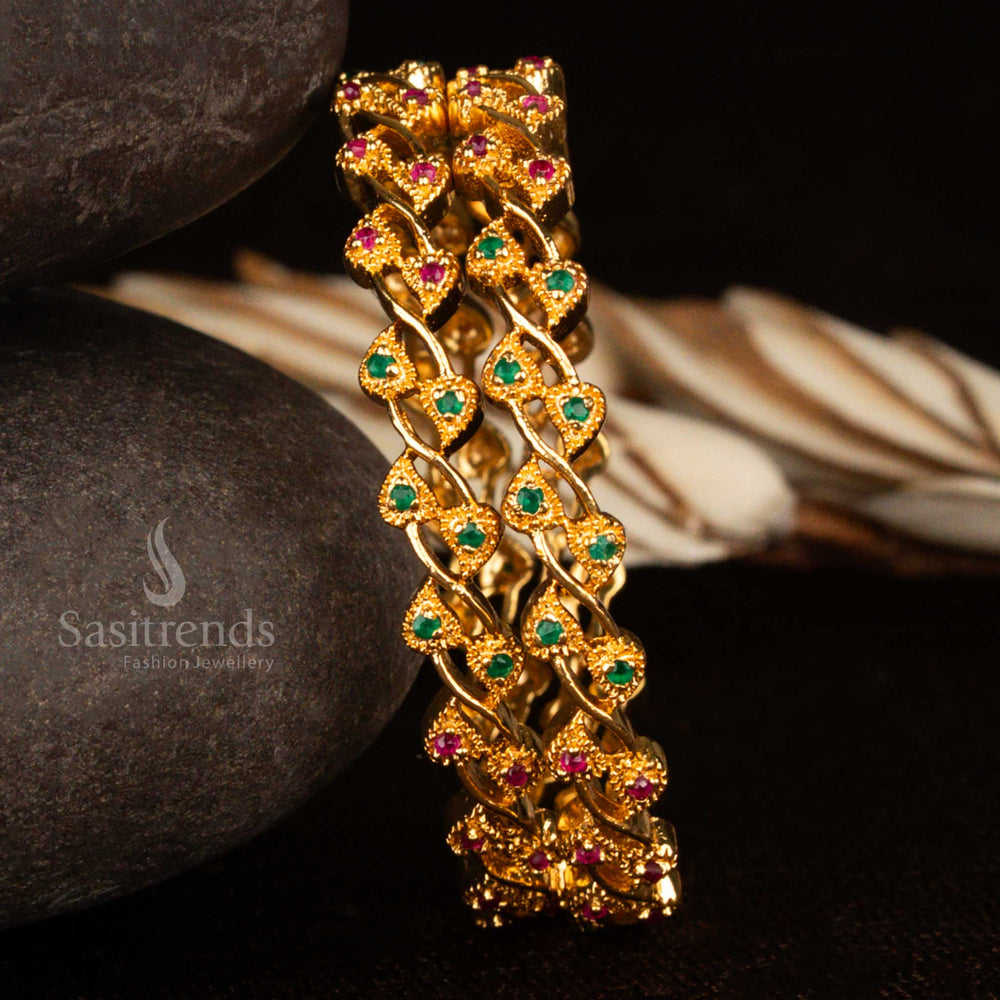 Traditional leafy design bangles in rich micro gold polish with vibrant ruby-green CZ stones – a guaranteed ethnic jewellery set reflecting royal heritage and festive allure by Sasitrends