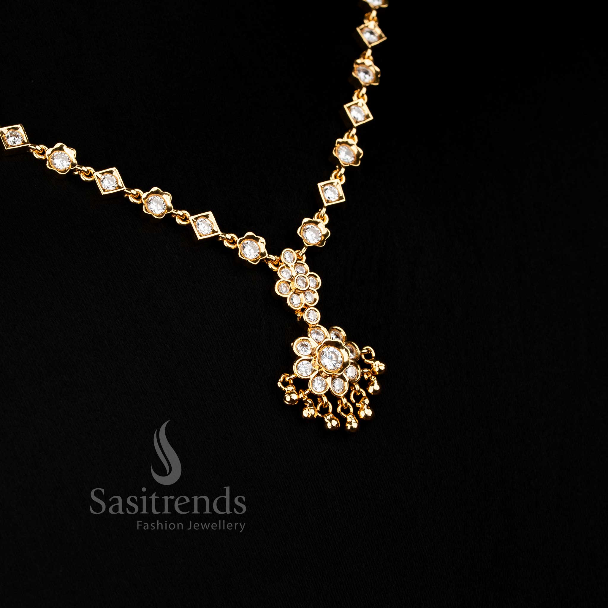 Elegant white American Diamond floral necklace with crystal glow and golden bead accents suitable for bridal and festive Jewellery - Sasitrends