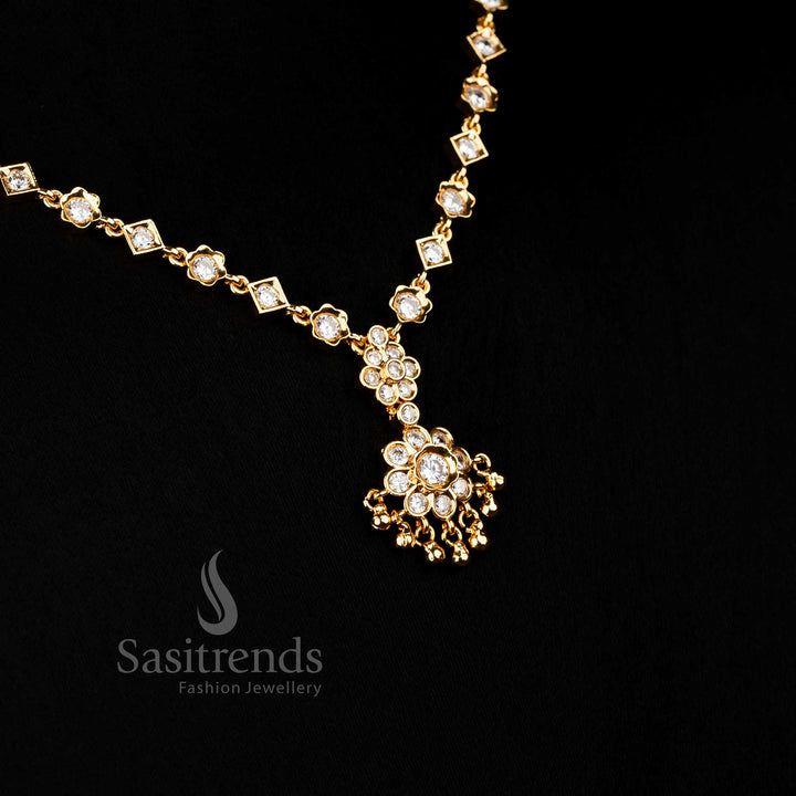 Elegant white American Diamond floral necklace with crystal glow and golden bead accents suitable for bridal and festive Jewellery - Sasitrends