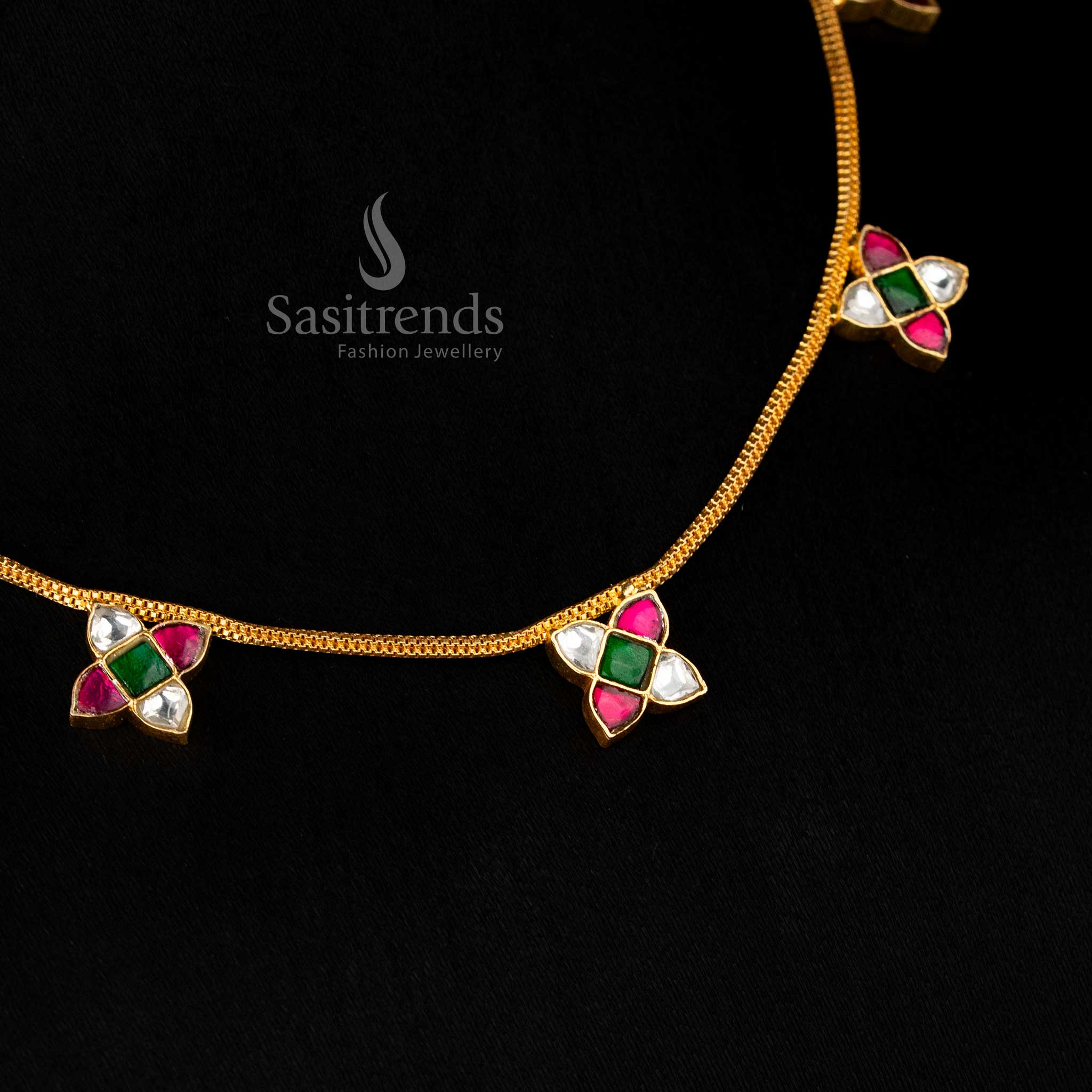 Opulent Jadau 24K gold plated necklace with delicate four-petal flower clusters and pearl danglers, designed for weddings and festive celebrations – Sasitrends
