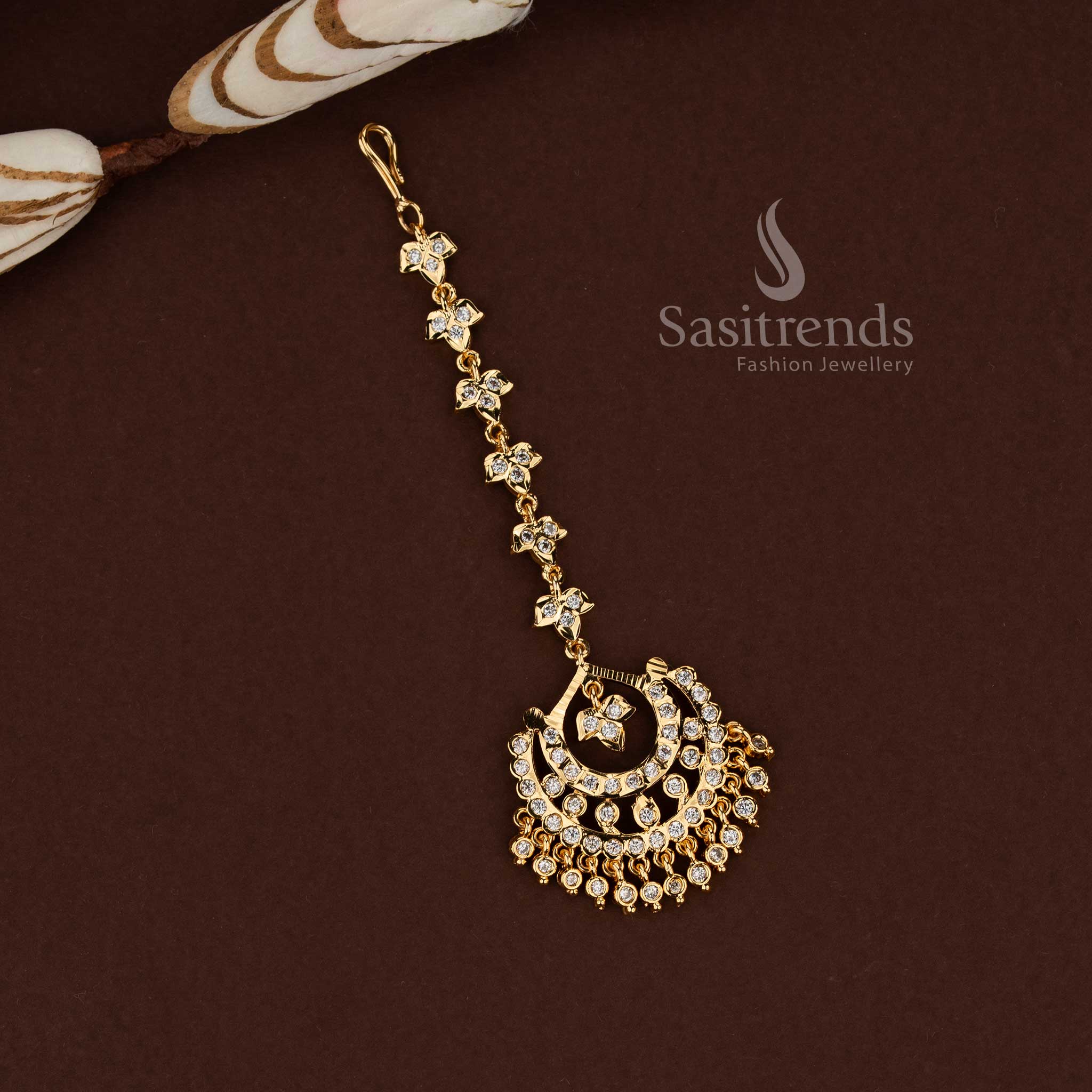 Luminous white stone crescent moon style Impon micro gold plated AD maang tikka designed for wedding functions festive occasions and graceful bridal fashion - Sasitrends