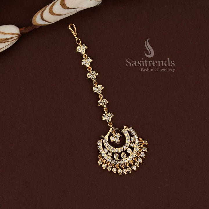 Luminous white stone crescent moon style Impon micro gold plated AD maang tikka designed for wedding functions festive occasions and graceful bridal fashion - Sasitrends