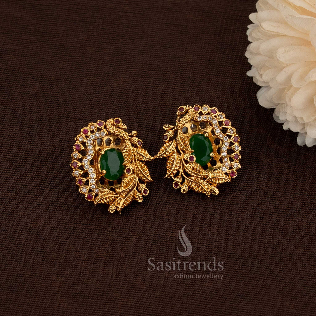 Matte Gold Plated Temple Stud Earrings Featuring Sparkling American Diamond Stones And An Elegant Leaf Peacock Motif, Designed For Classic Bridal Wear And Traditional Grace – Sasitrends