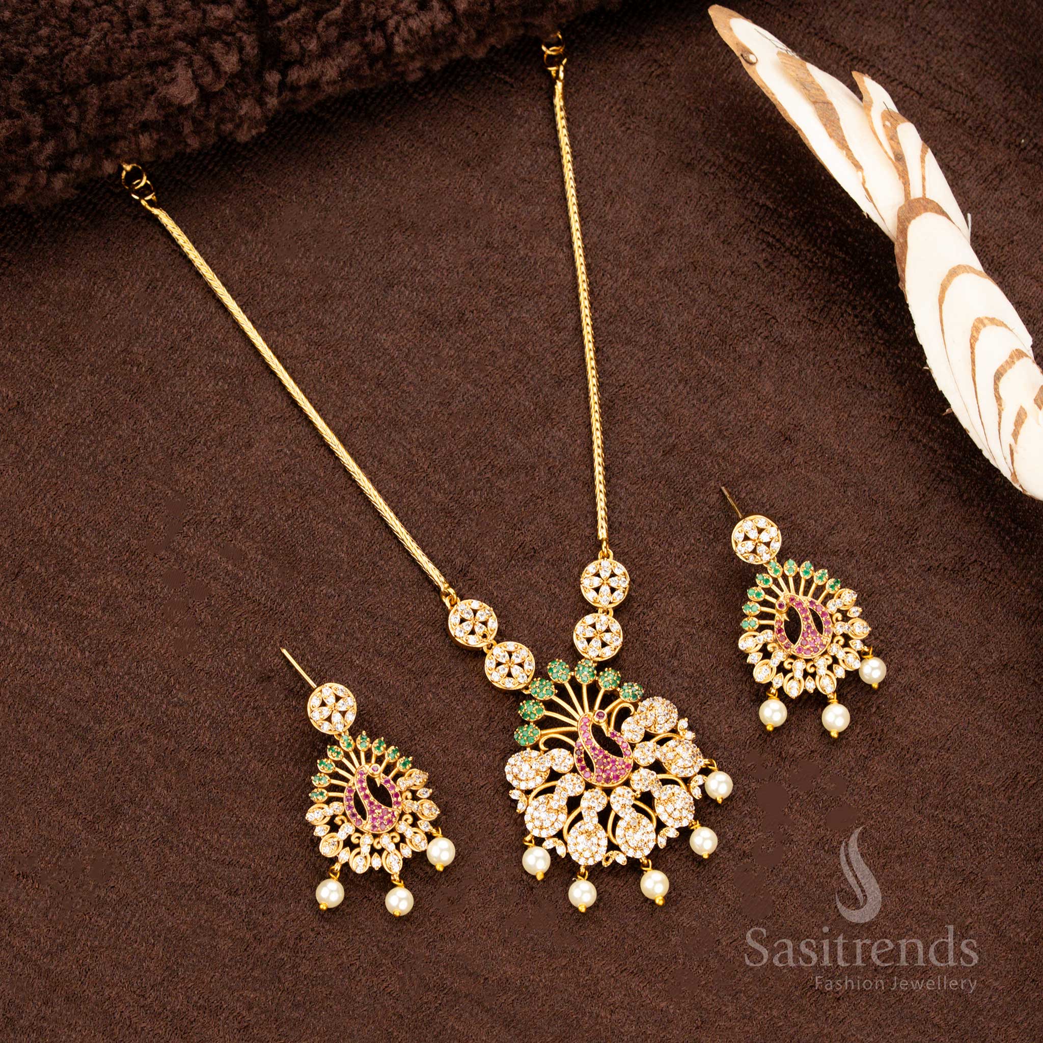 Designer temple-style matte gold plated peacock jewellery set AD stone studded with vibrant multi-gemstone embellishments, crafted to enhance women’s festive attire, ethnic weddings - Sasitrends