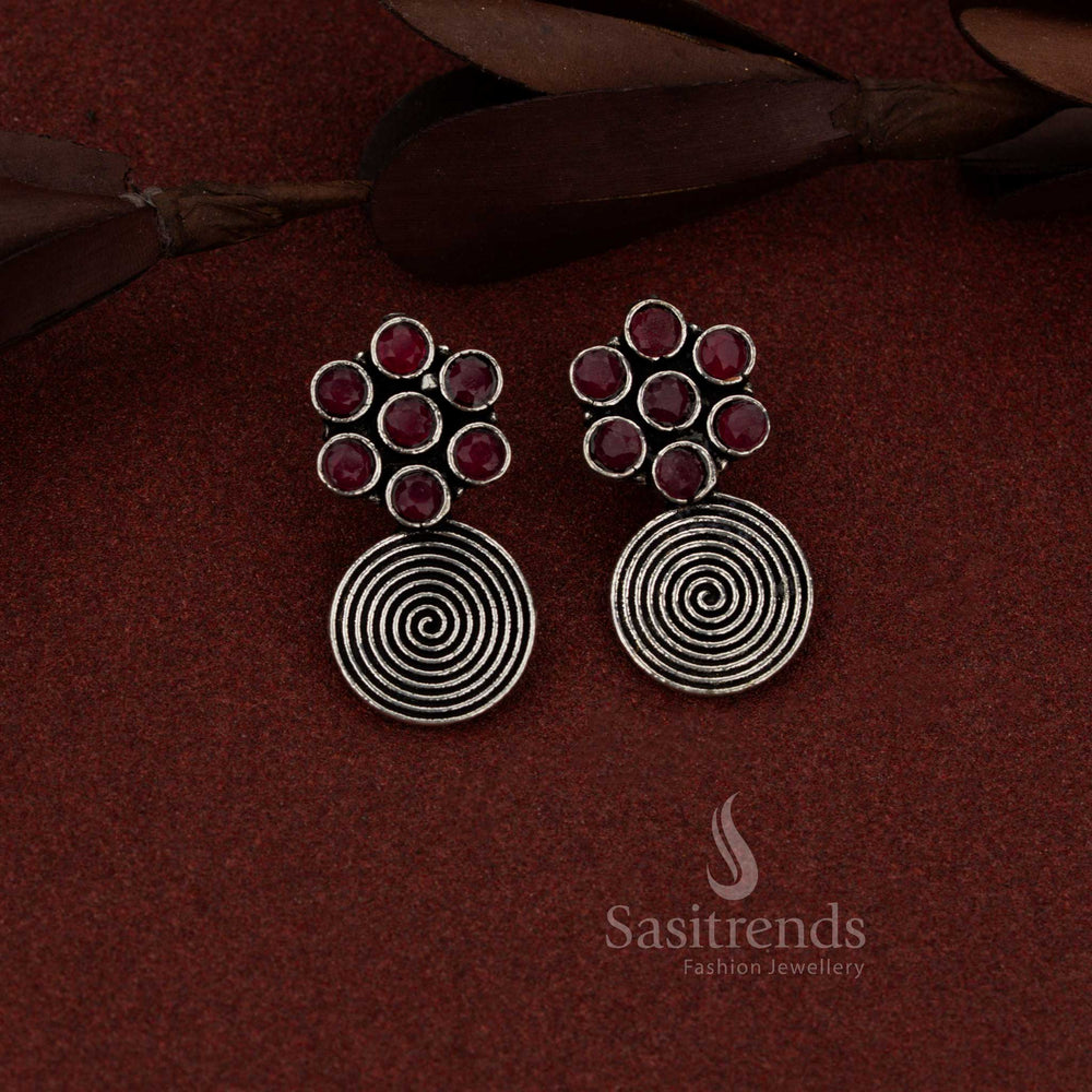 Regal oxidised silver floral spiral dangler earrings in ruby colour suited for festive outings and special evenings – Sasitrends