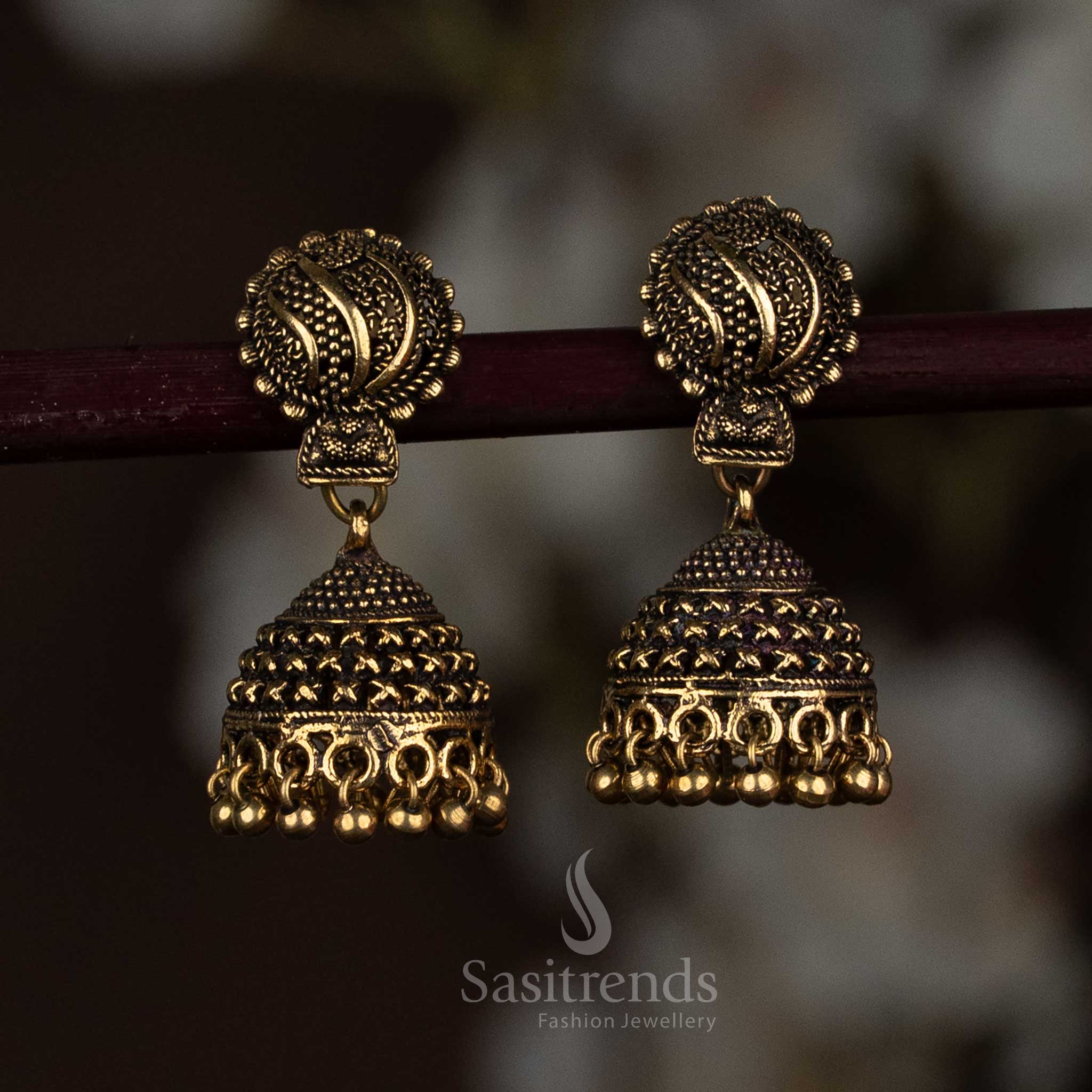 Gleaming Antique Gold Oxidised Dome Jhumka Earrings Featuring A Textured Surface And Sculpted Round Drop Finish, Designed For A Bold Yet Elegant Statement – Sasitrends