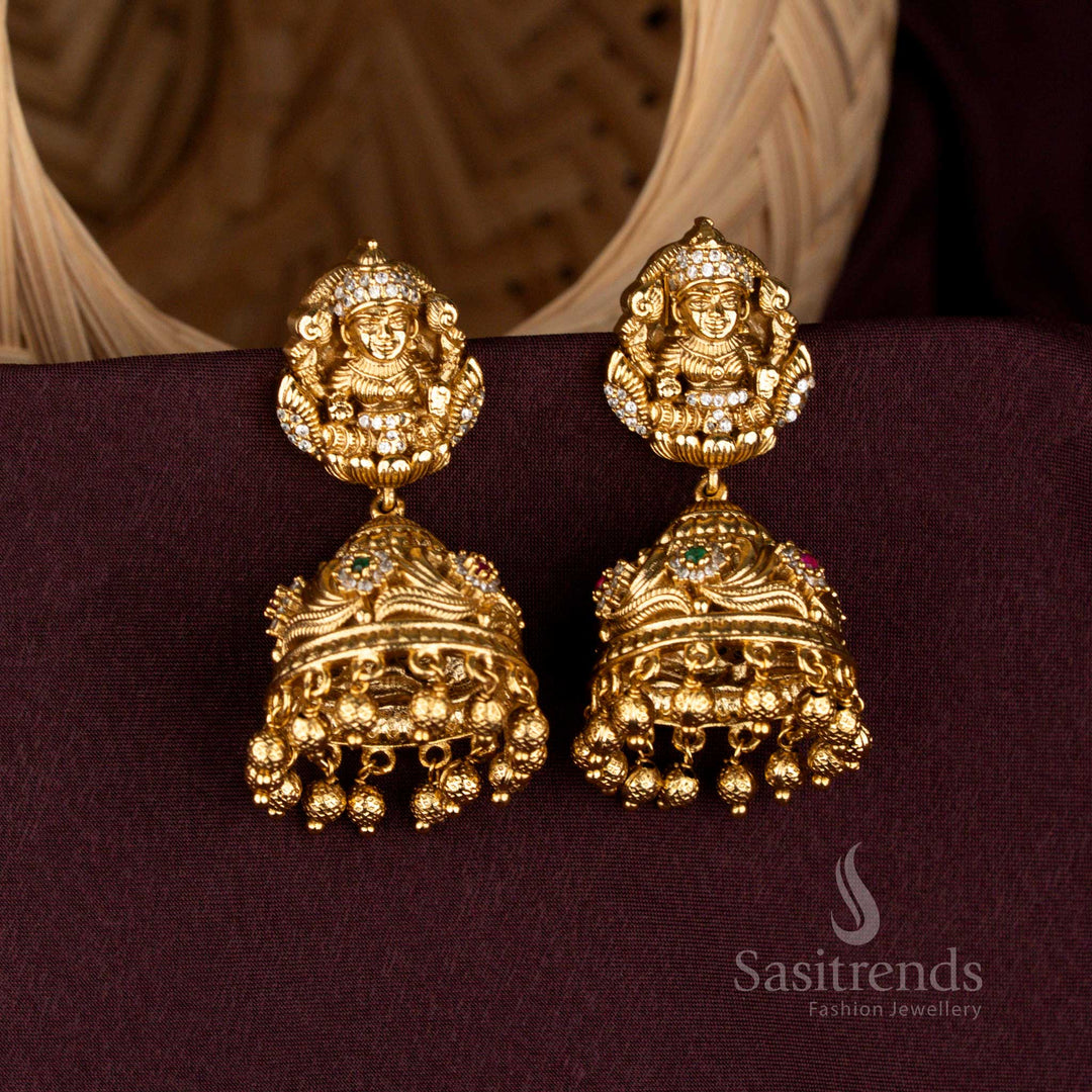 Eternal Lakshmi temple jhumka earrings crafted with carved domes, opulent bead danglers, grandiose matte gold artistry, aristocratic detailing, and heritage bridal refinement – Sasitrends