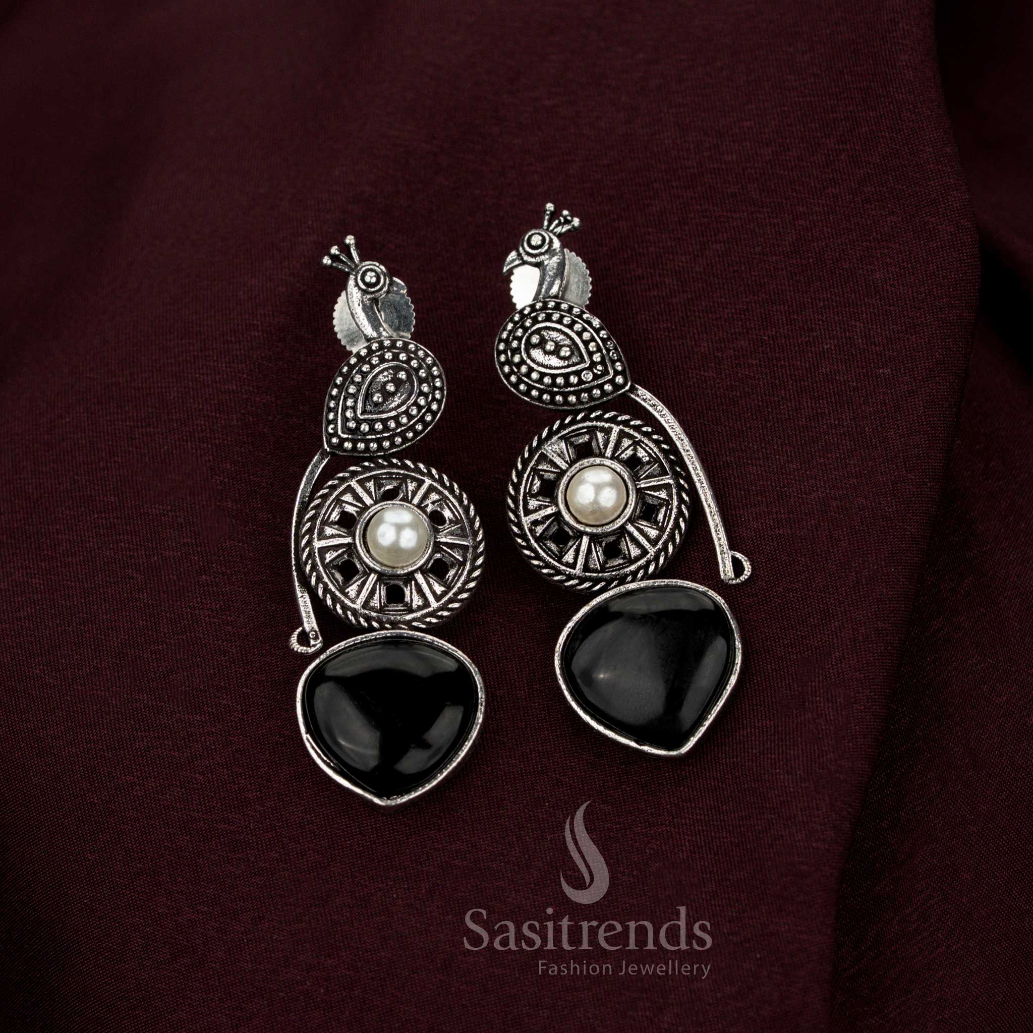 Sovereign black oxidised peacock earrings crafted with radiant pearl drops and intricate artistry perfect for heritage Navarathri wear aristocratic grace and exquisite jewellery elegance – Sasitrends