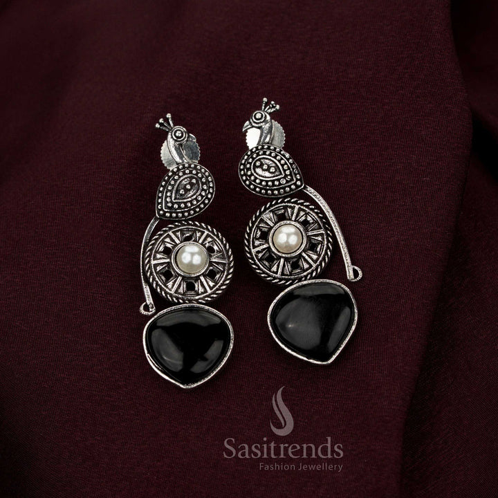 Sovereign black oxidised peacock earrings crafted with radiant pearl drops and intricate artistry perfect for heritage Navarathri wear aristocratic grace and exquisite jewellery elegance – Sasitrends