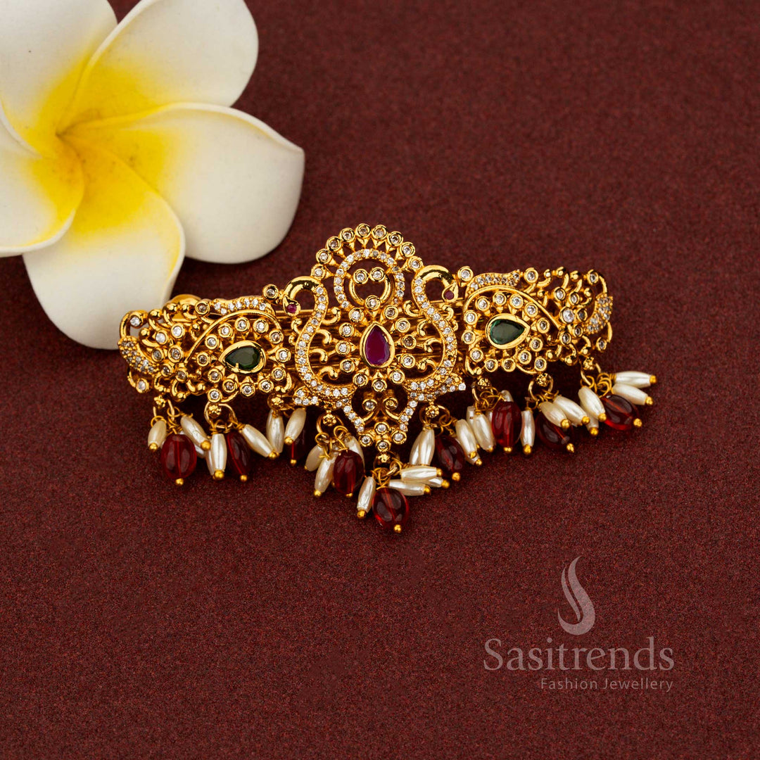 Ornate red temple hair clip with teardrop floral patterns, radiant matte gold plating, AD stone embellishments, and pearl danglers – Sasitrends