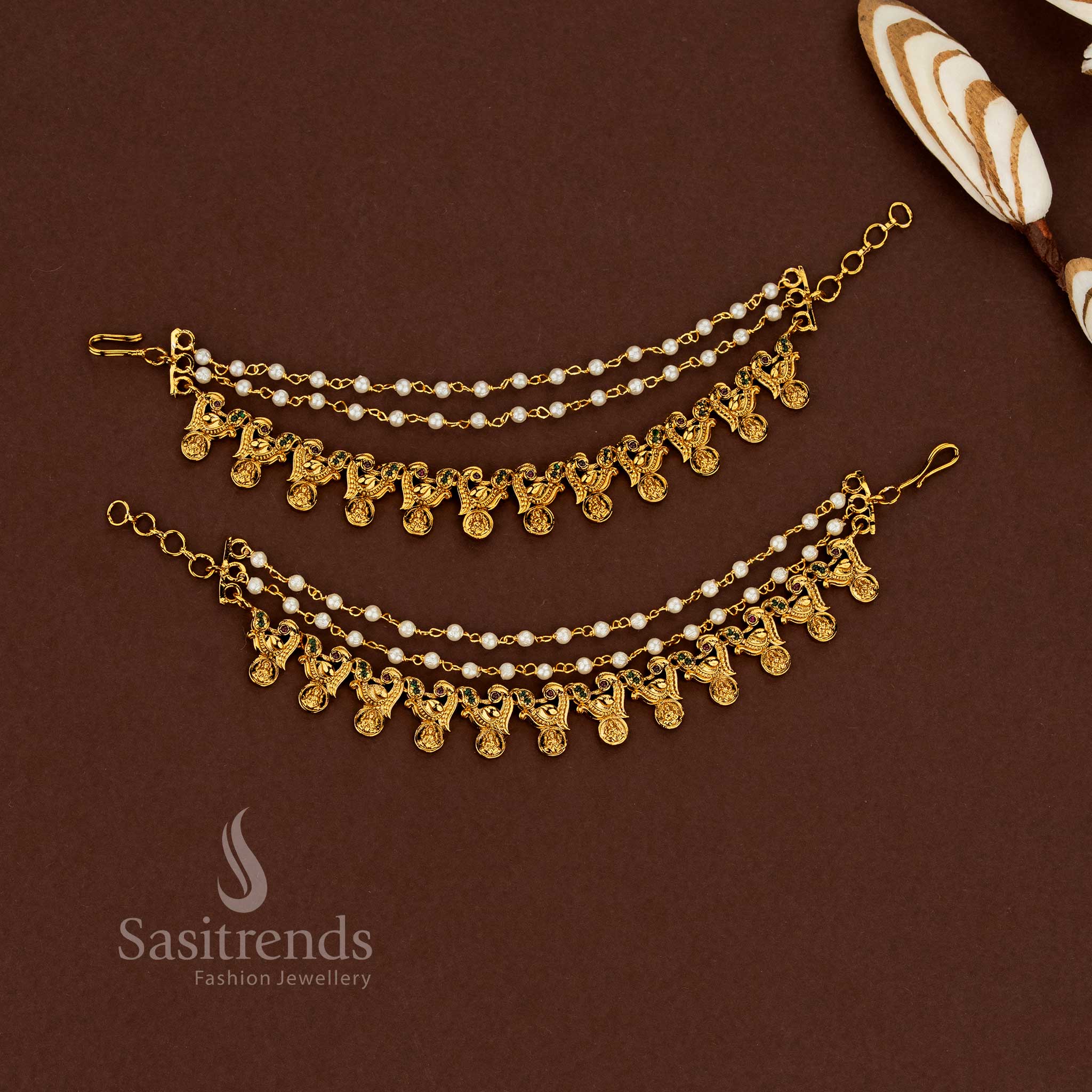 Heirloom style Lakshmi design temple matte gold plated American diamond matil ear chains featuring ruby-green stone combination and delicate pearl touches for wedding rituals - Sasitrends