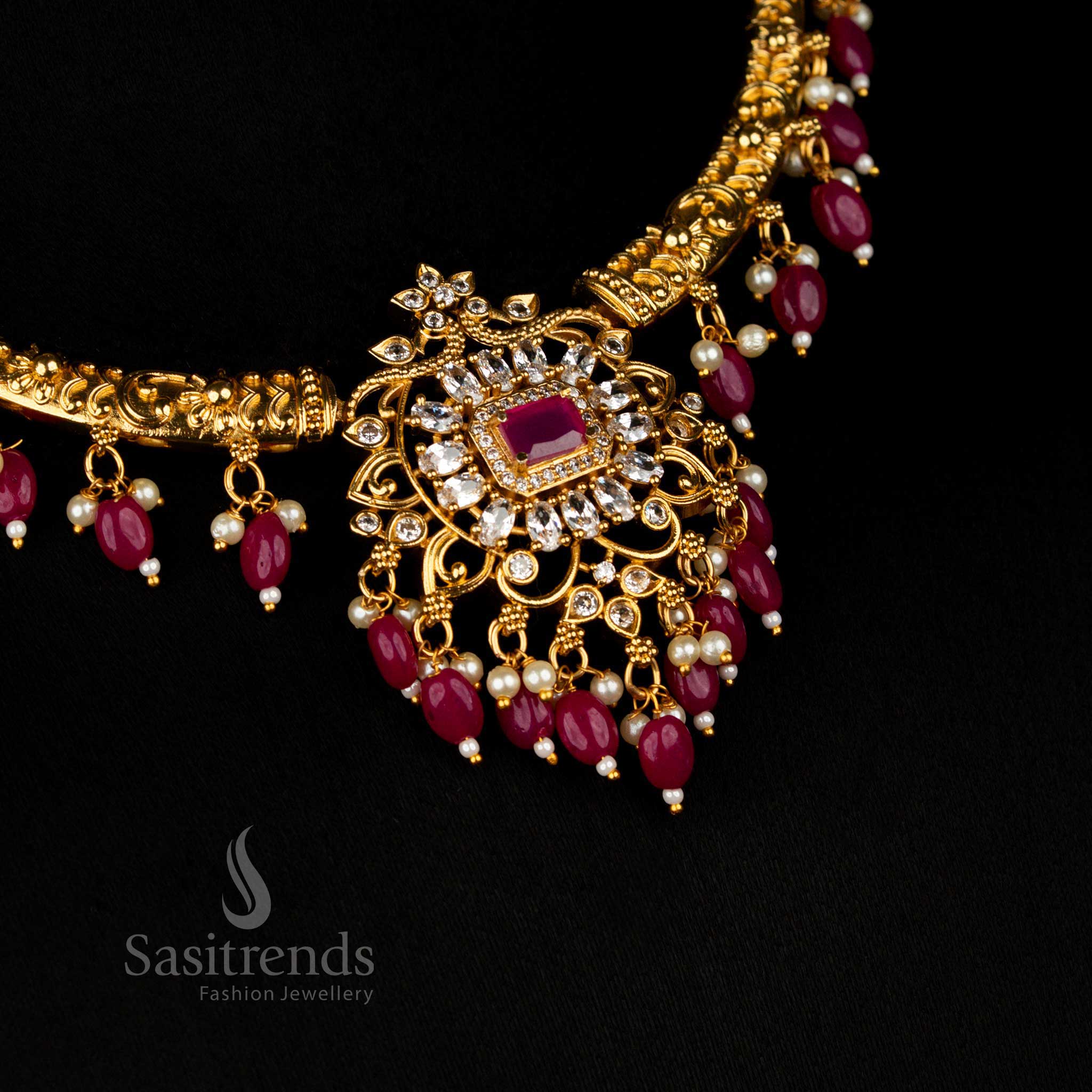 Opulent Ruby Pearl Matte Gold Plated Temple Necklace Showcasing Artisan Filigree Pendant and Glittering AD Stones for Luxurious Festive Occasions – Sasitrends