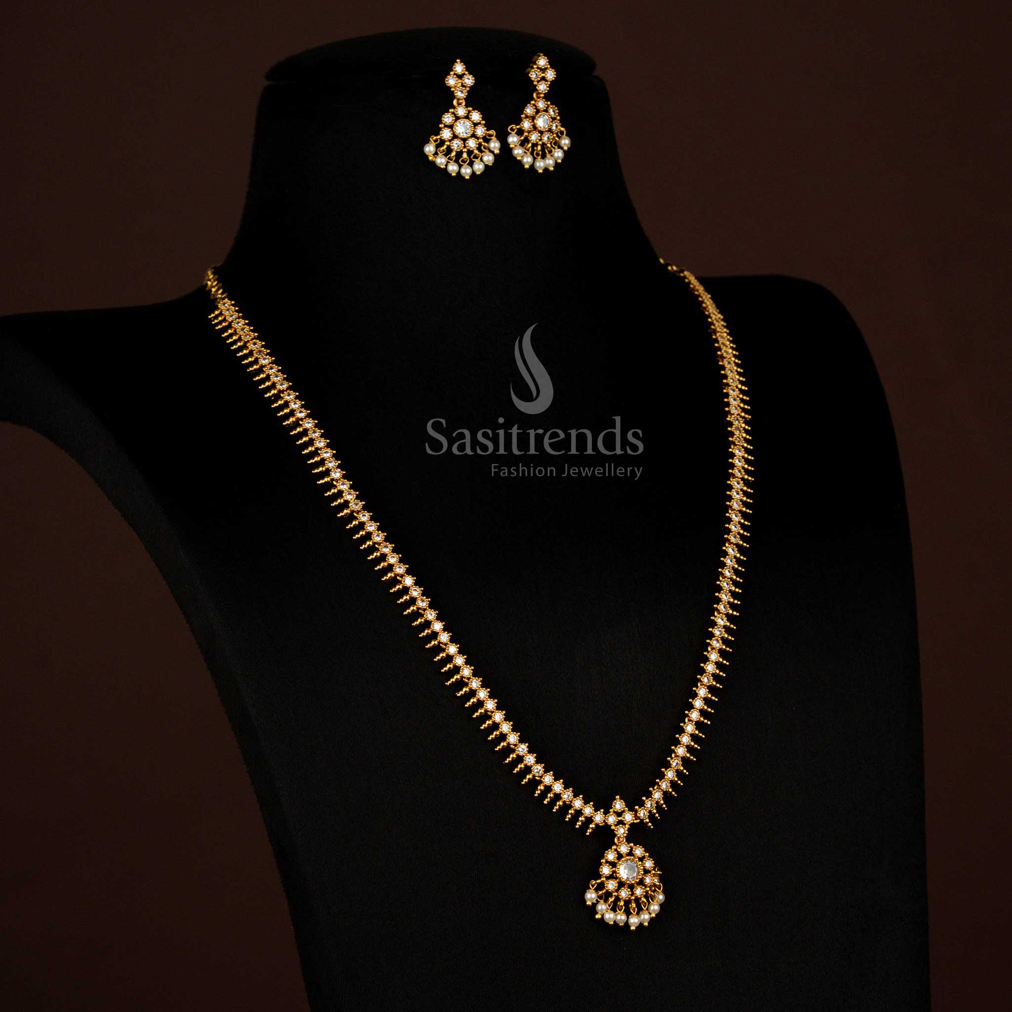 Serene White Matte Gold Temple Long Necklace Featuring Graceful Circular Floral Motifs and Sparkling AD Stones, Perfect for Elegant Wedding Wear – Sasitrends