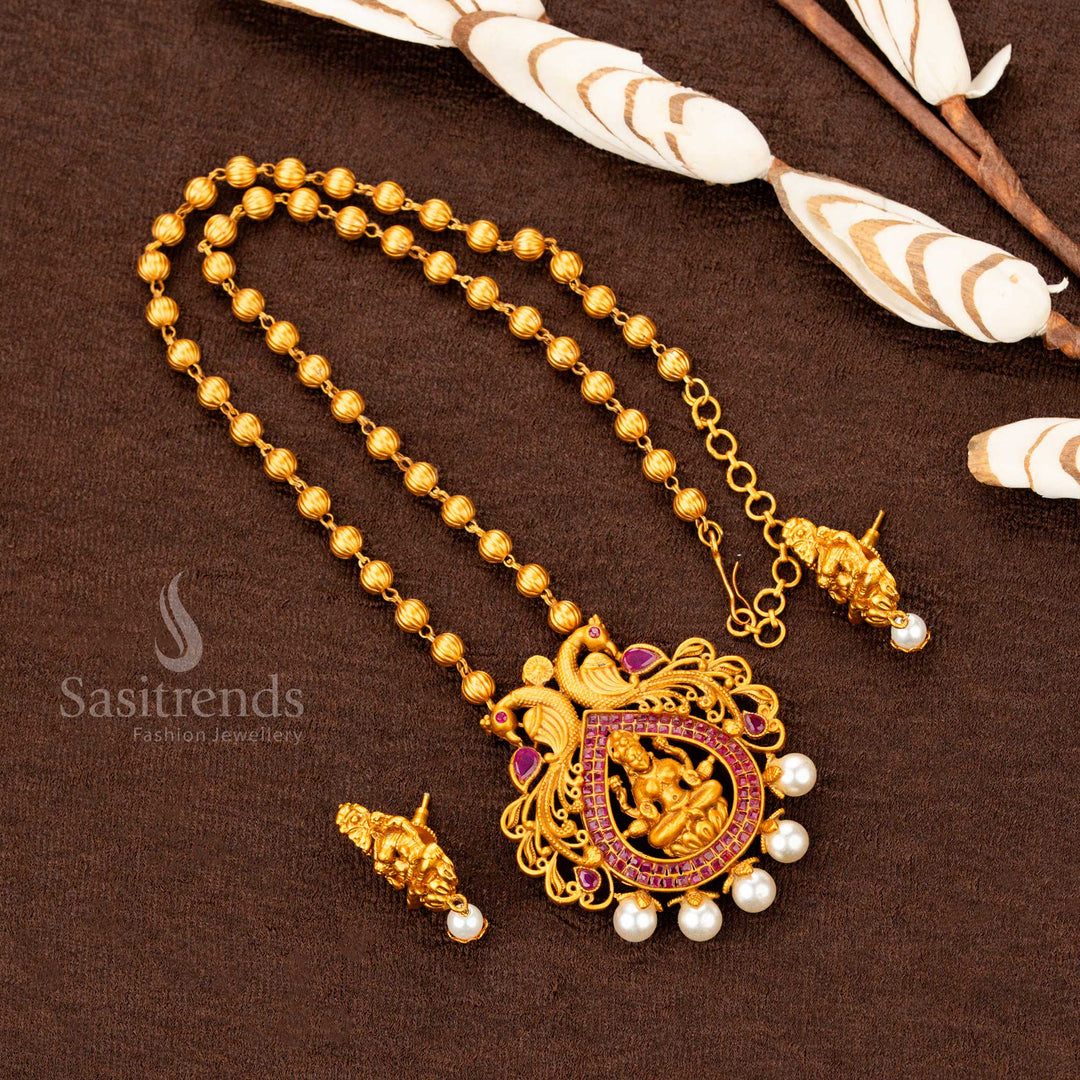 Opulent Matte Gold Plated Ruby Lakshmi Pendant with Pearl Ball Chain Necklace – Exquisite temple jewellery for saree and bridal occasions – Sasitrends