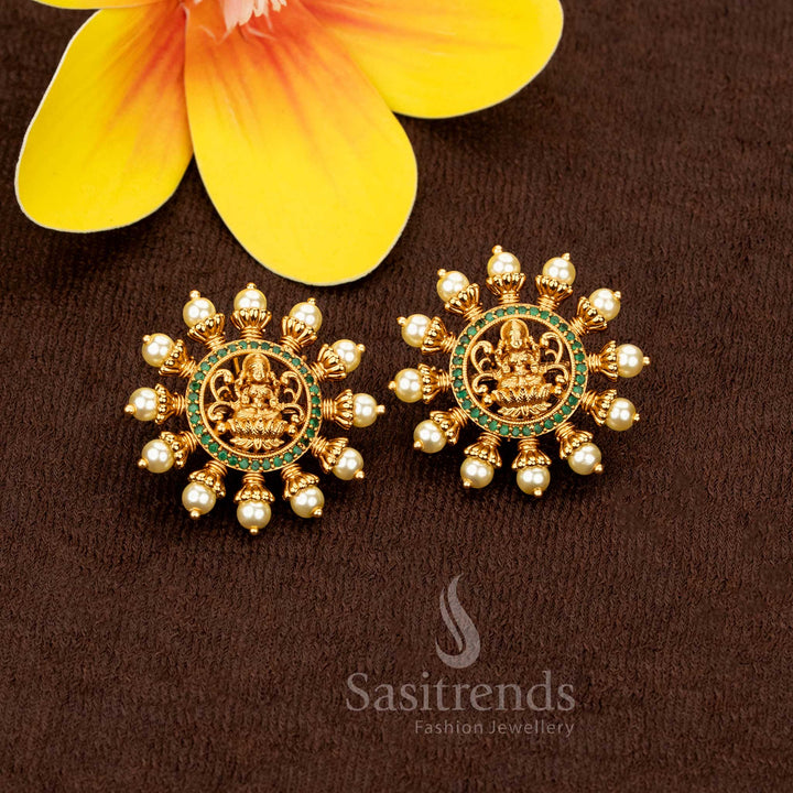 Vibrant green matte gold plated Lakshmi motif pearl stud earrings, perfect for temple festivities and ethnic bridal ensembles – Sasitrends