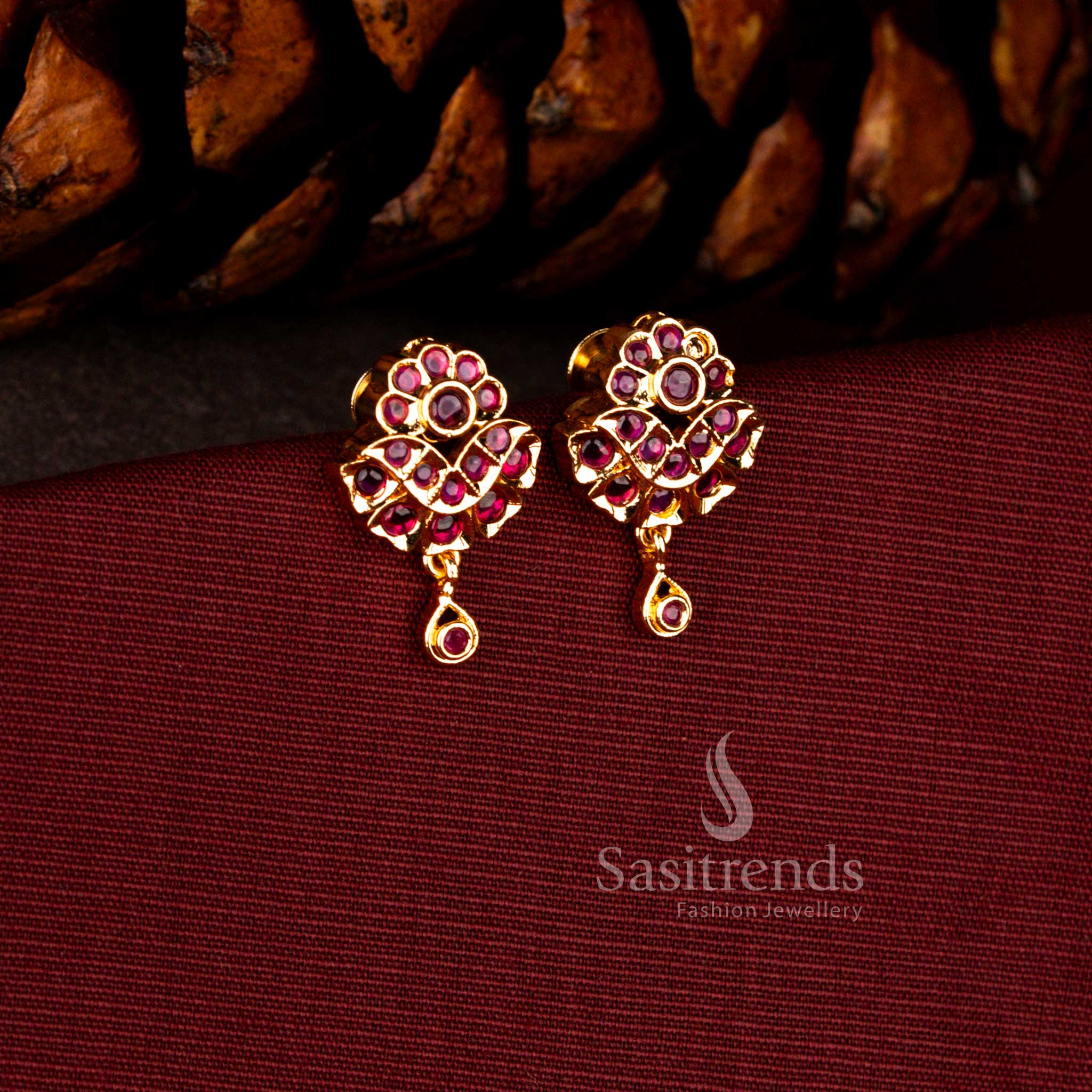 Regal micro gold earrings in ruby featuring AD floral drop design with sculpted teardrop finish and radiant gold glow – Sasitrends