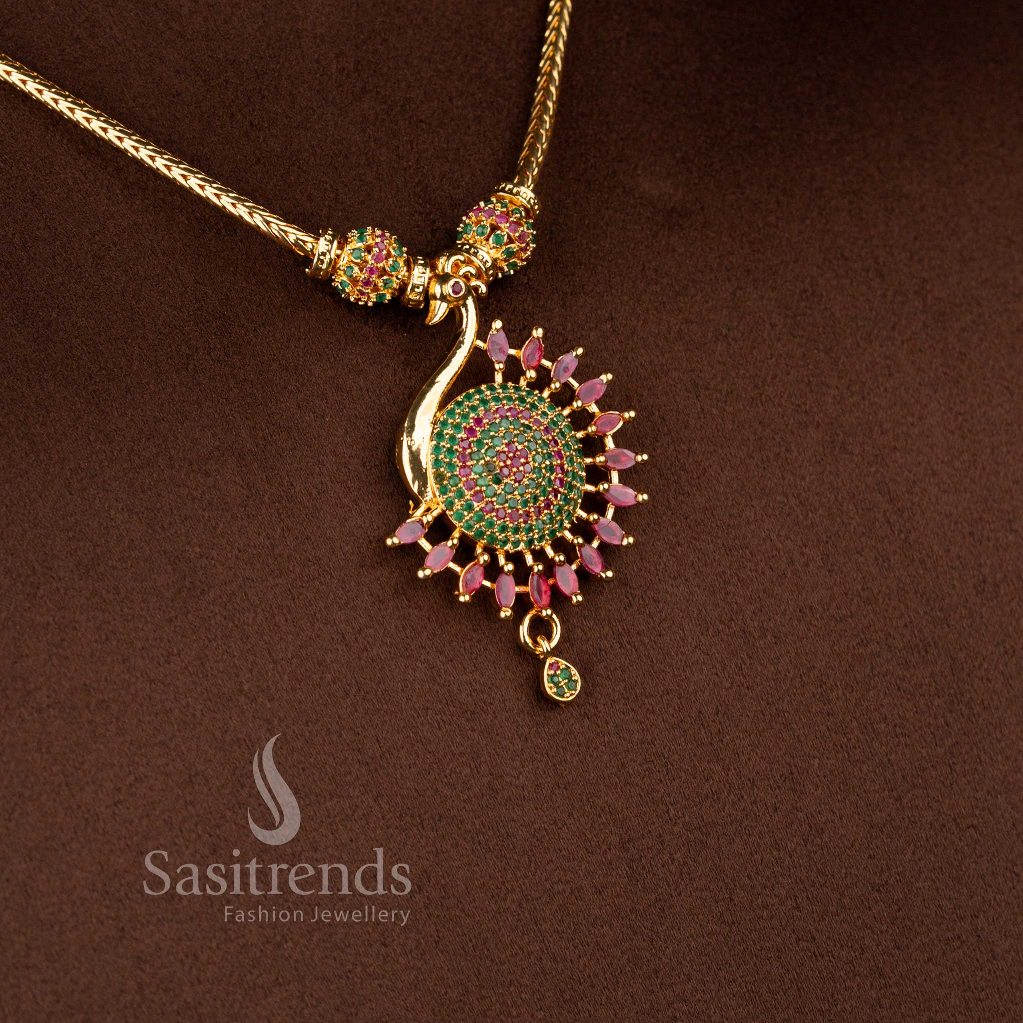 Regal micro gold plated peacock necklace in ruby-green tones featuring intricate gemstone detailing and pearl accents for festive or bridal wear – Sasitrends