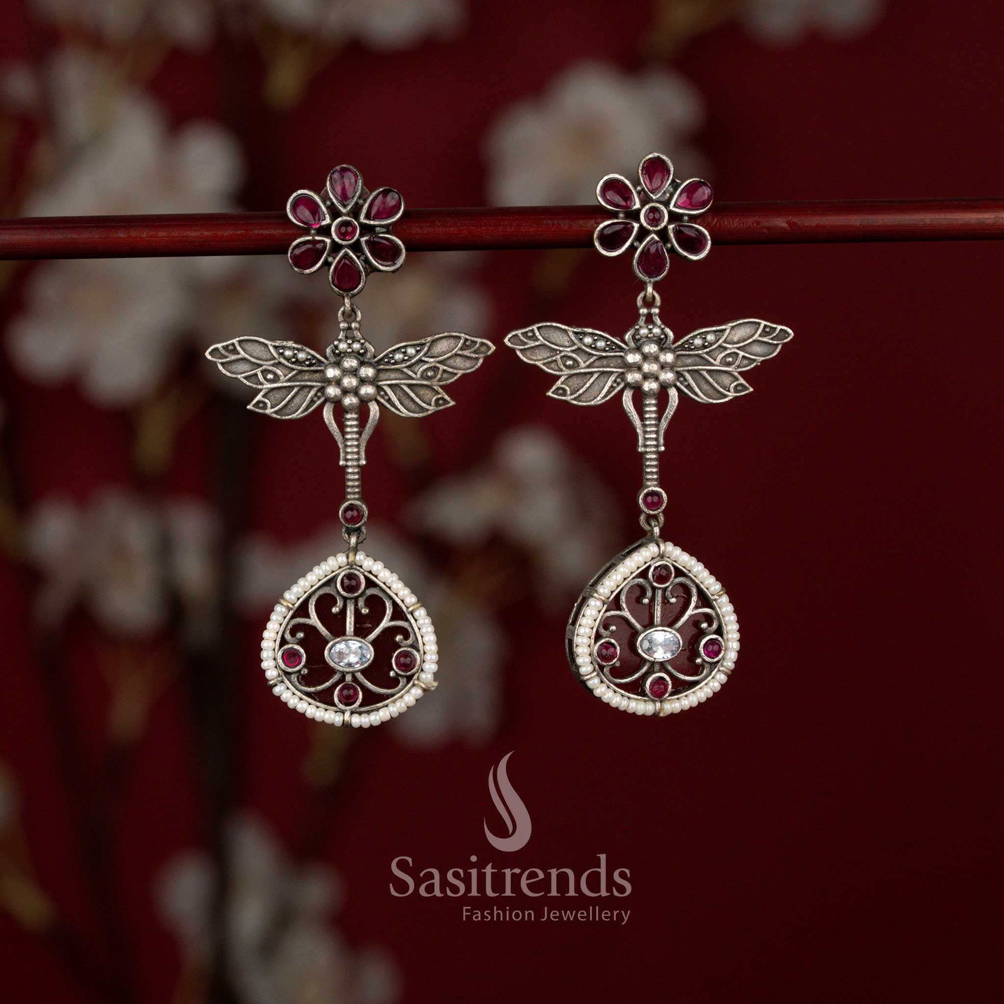 Beautiful Antique Oxidised 6-Petal Floral Dragonfly Wings Teardrop Earrings with Pearl Accents for Navarathri Wear - Sasitrends