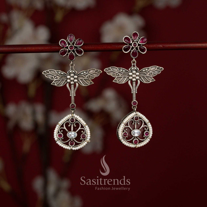 Beautiful Antique Oxidised 6-Petal Floral Dragonfly Wings Teardrop Earrings with Pearl Accents for Navarathri Wear - Sasitrends
