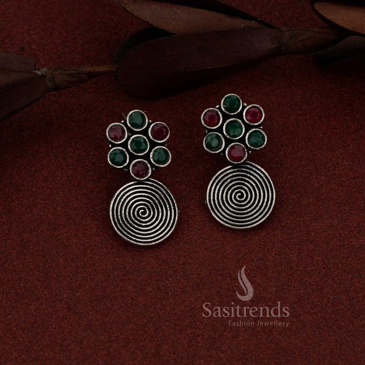 Opulent oxidised spiral flower drop earrings with ruby green stones suited for traditional gatherings and events – Sasitrends