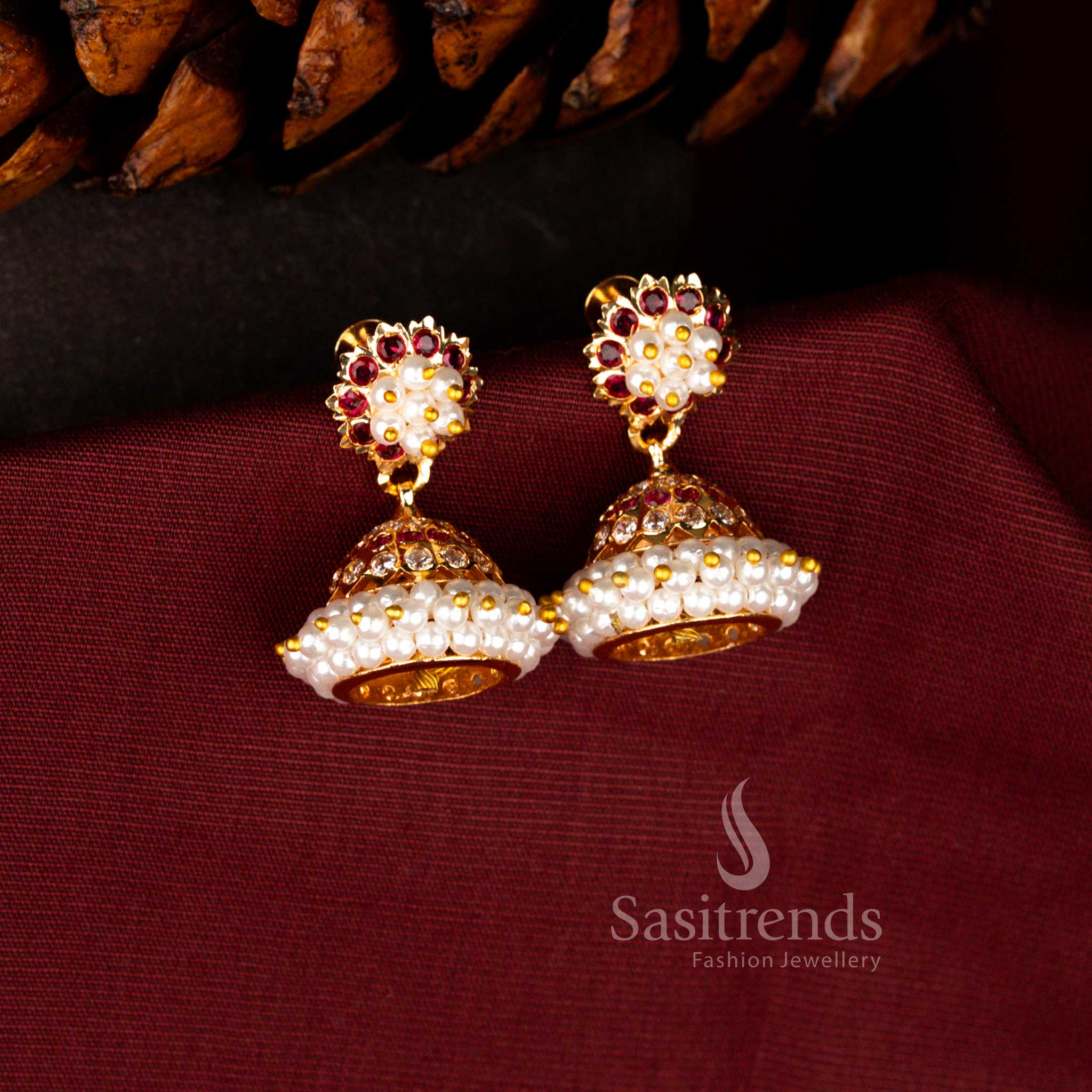 Opulent ceremonial earrings in white-ruby highlighting luminous AD embellishments, rich pearl detailing and artistic dome drop craftsmanship – Sasitrends