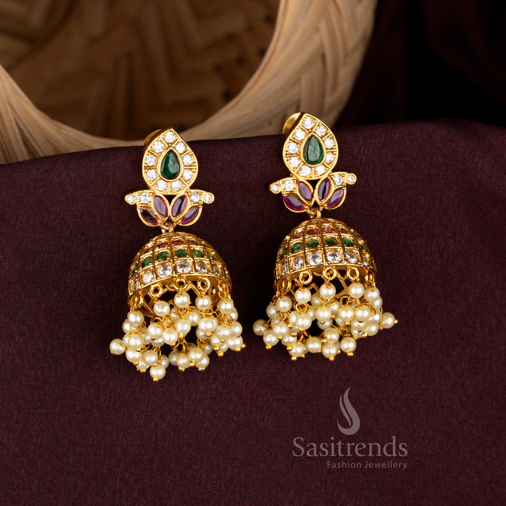 Celestial paisley leaf teardrop jhumka earrings styled with noble matte gold finish, splendid AD brilliance, eternal pearl danglers, and grandiose artistry for bridal refinement – Sasitrends