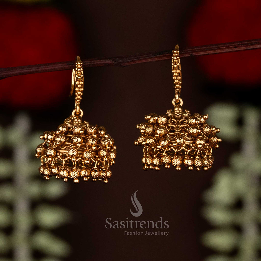 Luxurious temple matte gold textured ball jhumka earrings with fish hook perfect for bridal elegance - Sasitrends