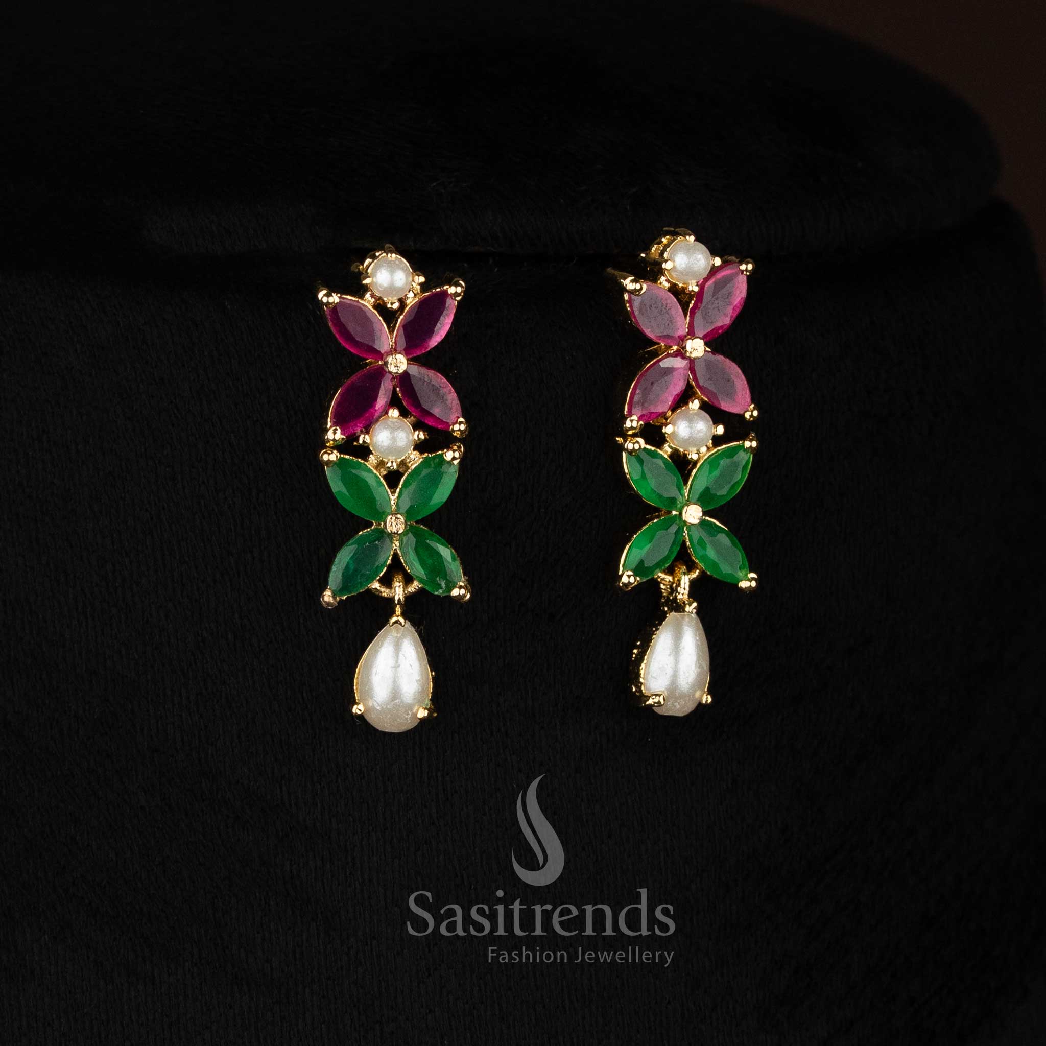 Lustrous micro gold plated ruby-green four petal AD floral earrings with pearls perfect for ceremonial functions and festive gatherings -Sasitrends