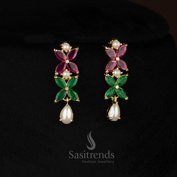 Lustrous micro gold plated ruby-green four petal AD floral earrings with pearls perfect for ceremonial functions and festive gatherings -Sasitrends