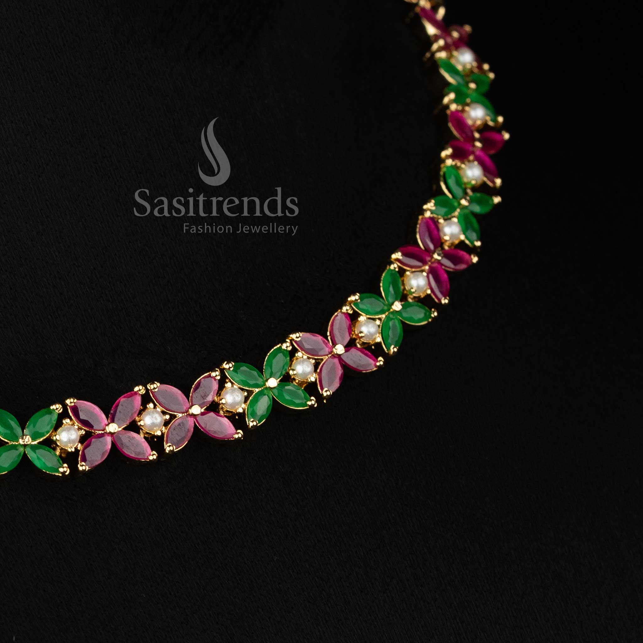 Chic micro gold plated ruby-green four petal AD floral necklace set with pearls curated for ethnic occasions and party styling -Sasitrends