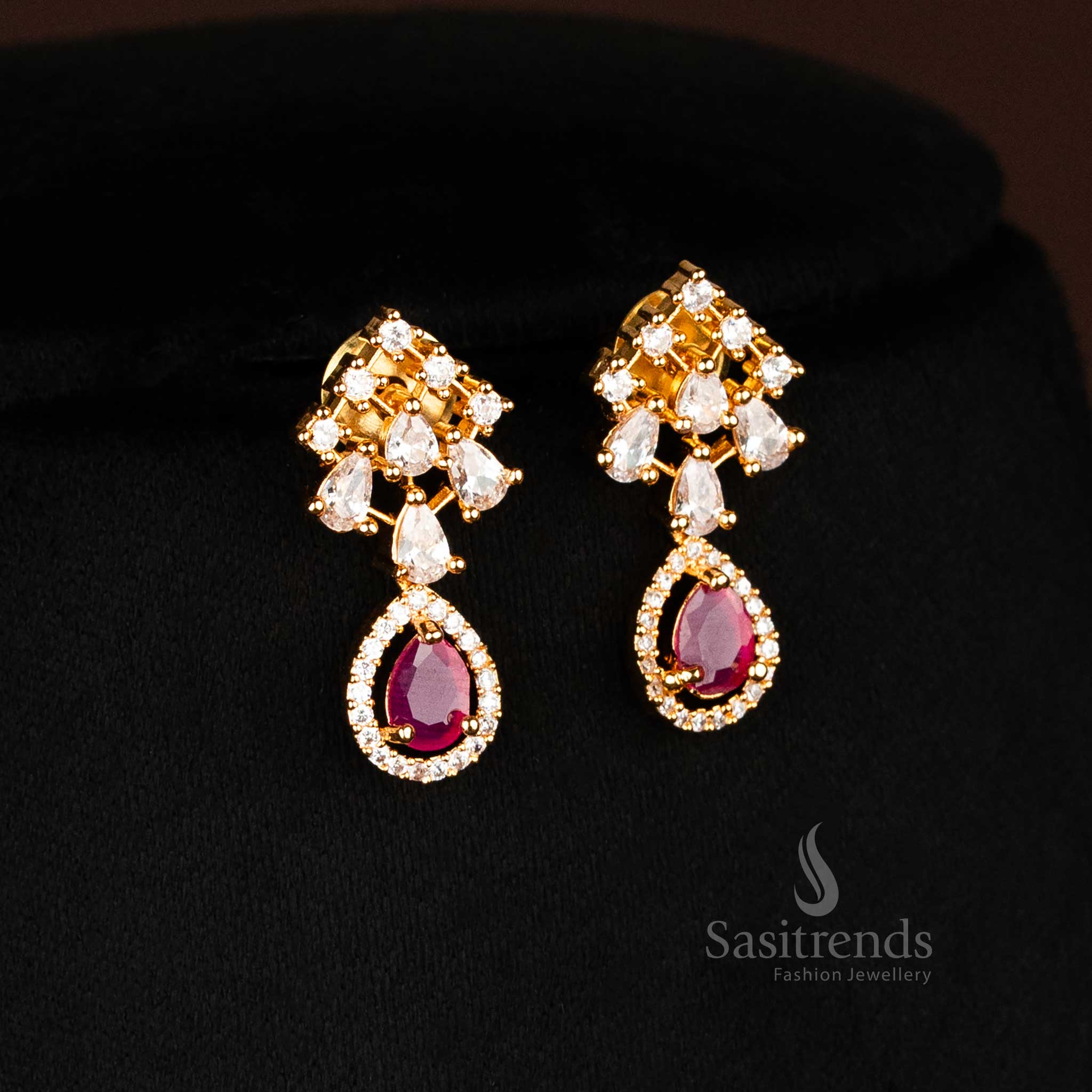 Elegant multi-strand earrings with ruby drop and white AD stones in a micro gold finish for regal bridal styling, jewellery by sasitrends