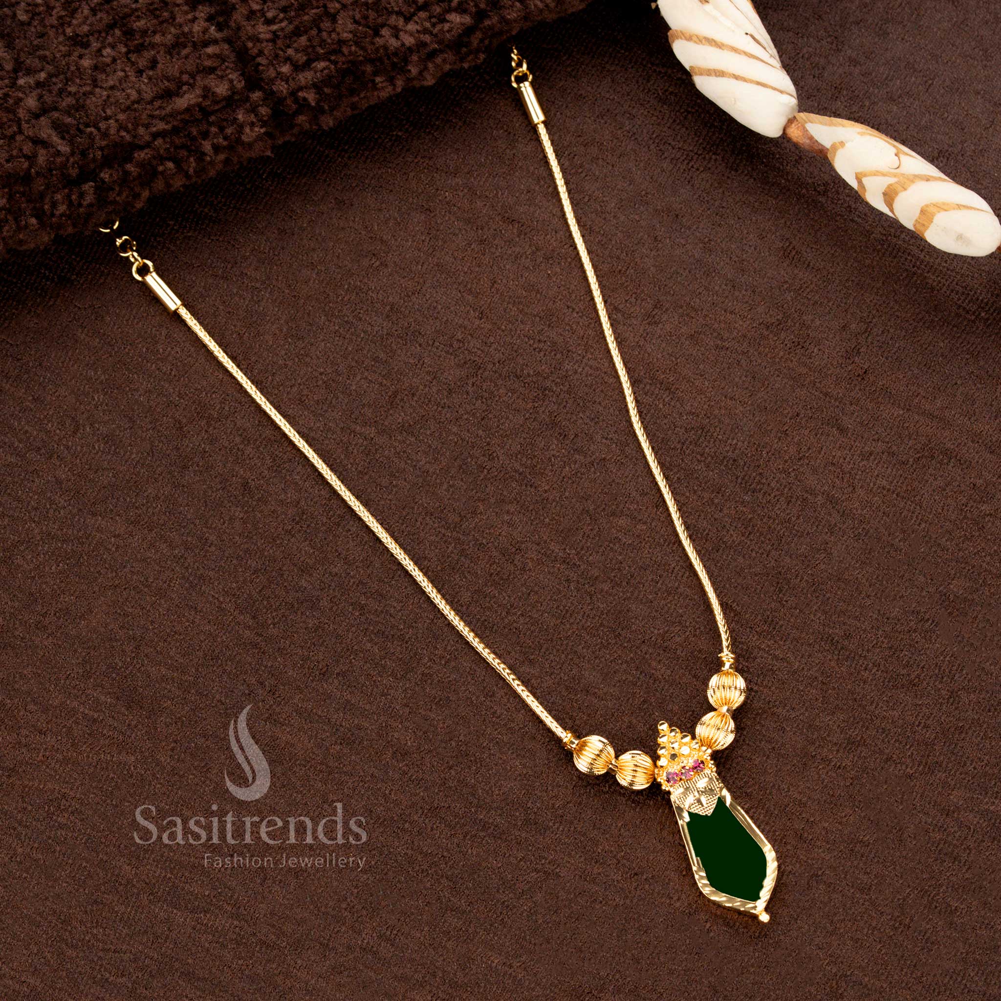 Elegant micro gold finish Green Nagapadam Palakka necklace featuring an intricate design and adjustable chain, offering a timeless ethnic look - Sasitrends