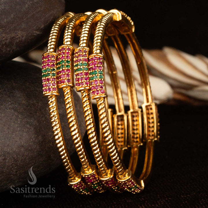 Ruby-green American diamond studded traditional bangles set in fine micro gold finish – a masterpiece of classic ethnic elegance perfect for grand occasions and saree wear by Sasitrends