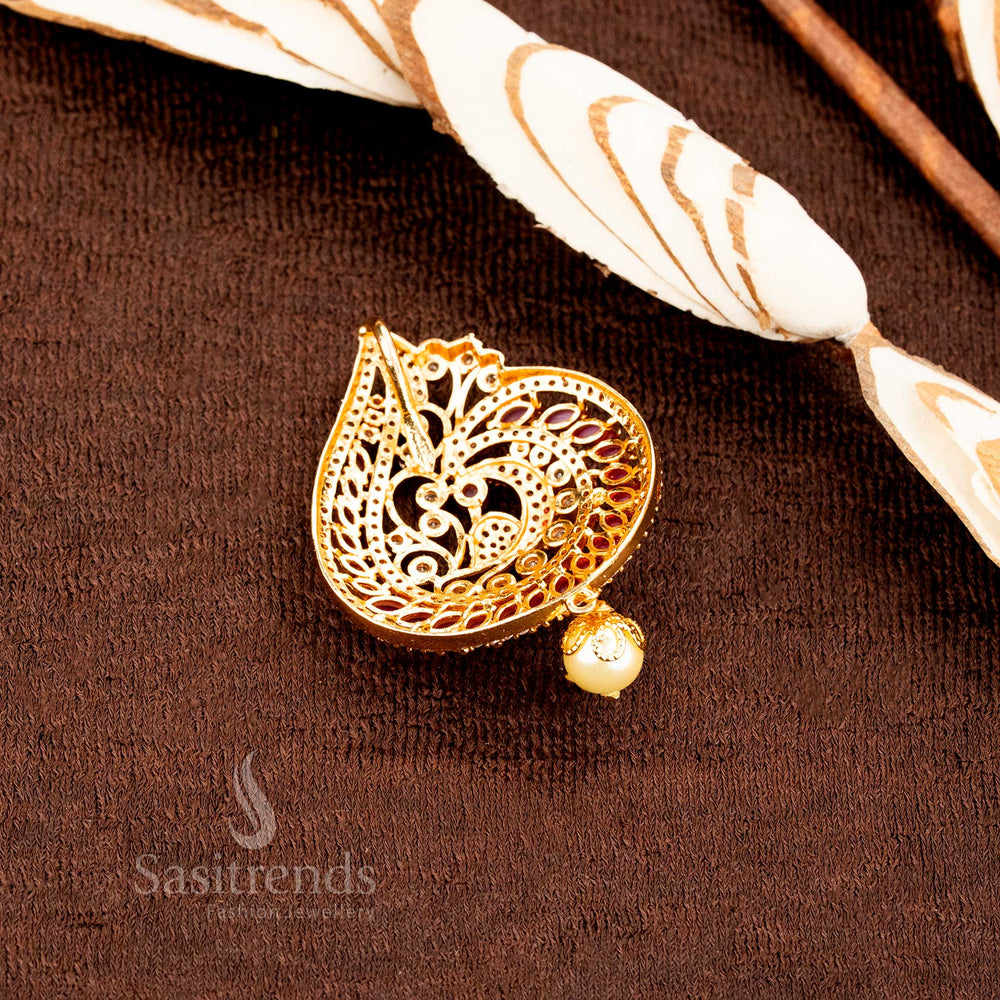 Classic peacock motif micro gold plated pendant set adorned with ruby and white AD stone highlights and matching ethnic earrings, reflecting temple grace and timeless traditional jewellery design by Sasitrends