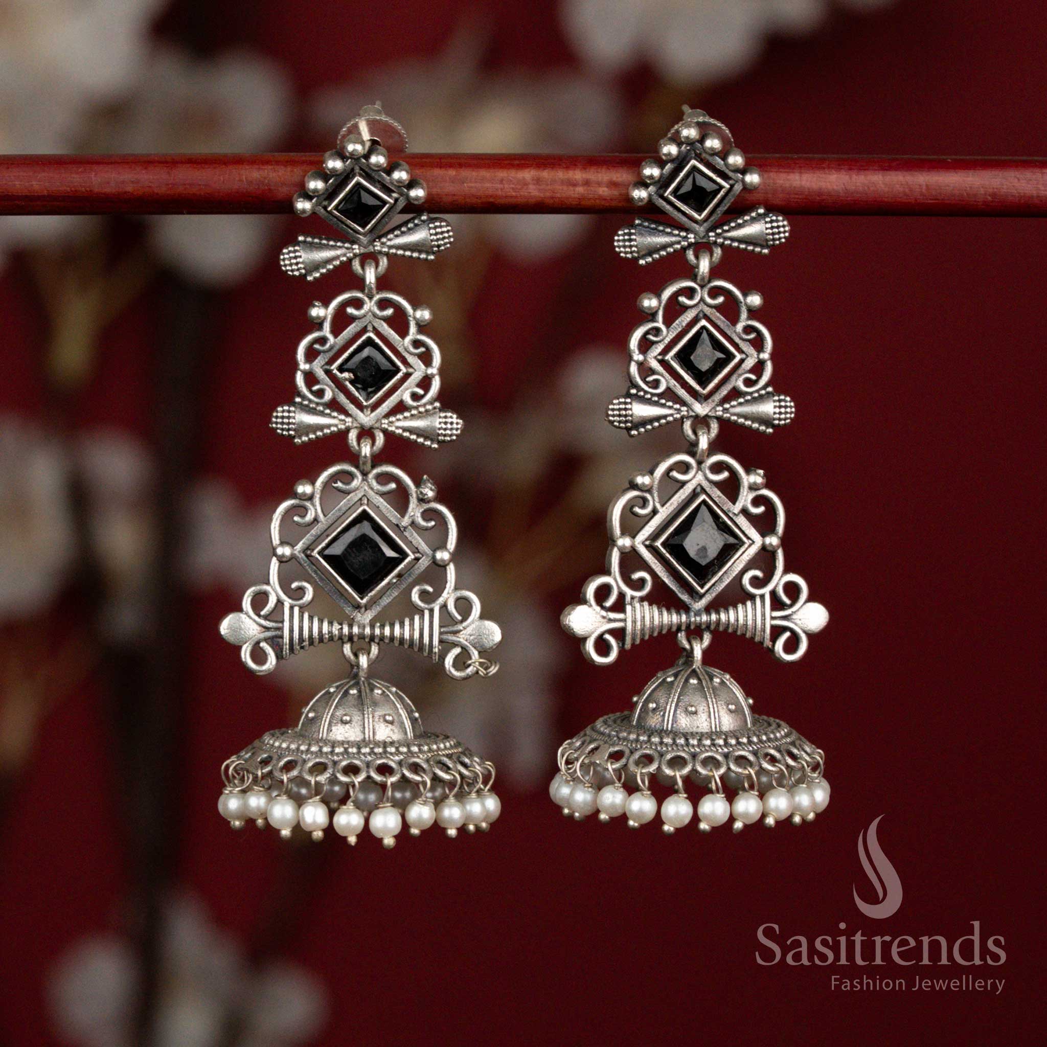 Deep black oxidised 92.5 silver geometric long jhumka earrings with stone highlights and pearl drops for ethnic styling - jewellery - Sasitrends