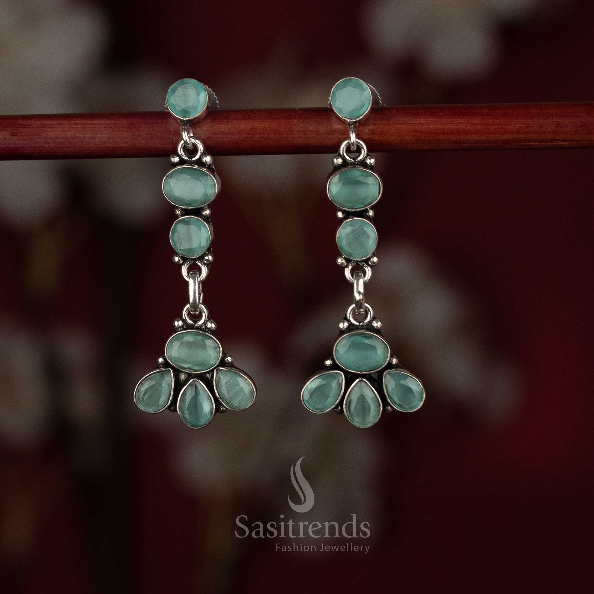 Mint oxidised silver earrings displaying soft-tone floral tiers arranged in a refined vertical drop – Sasitrends