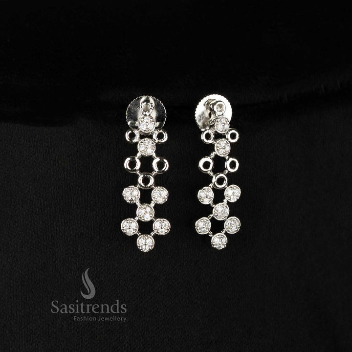 Striking Rhodium Plated American Diamond Earrings Set With Cool Geometric Link Motifs And Glossy Chrome Touch – Ideal For Chic Western Or Indo-Fusion Outfits – Sasitrends