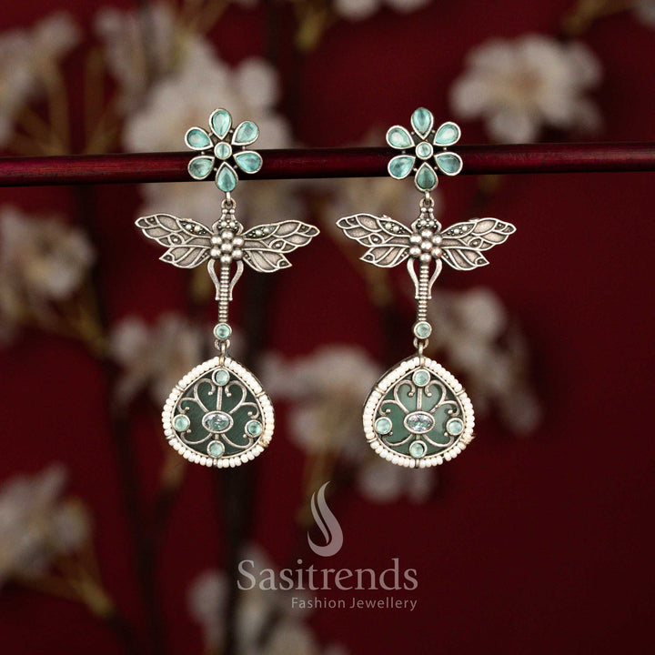 Elegant antique oxidised 6-petal floral dragonfly wings teardrop earrings adorned with pearl accents in soft mint tone for festive Navarathri – Sasitrends