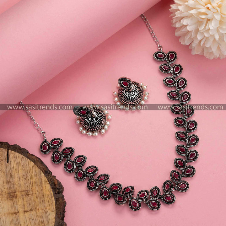 Radiant in Ruby: Oxidised German Silver Necklace with Pearl Jhumkas - Classic Beauty with a Modern Touch