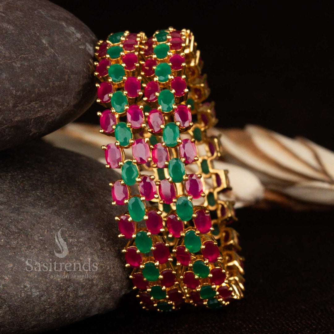 Ruby-green CZ bangles in micro gold polish with sparkling American diamond stone work and a timeless classic finish – a traditional jewellery style perfect for sarees and celebrations by Sasitrends