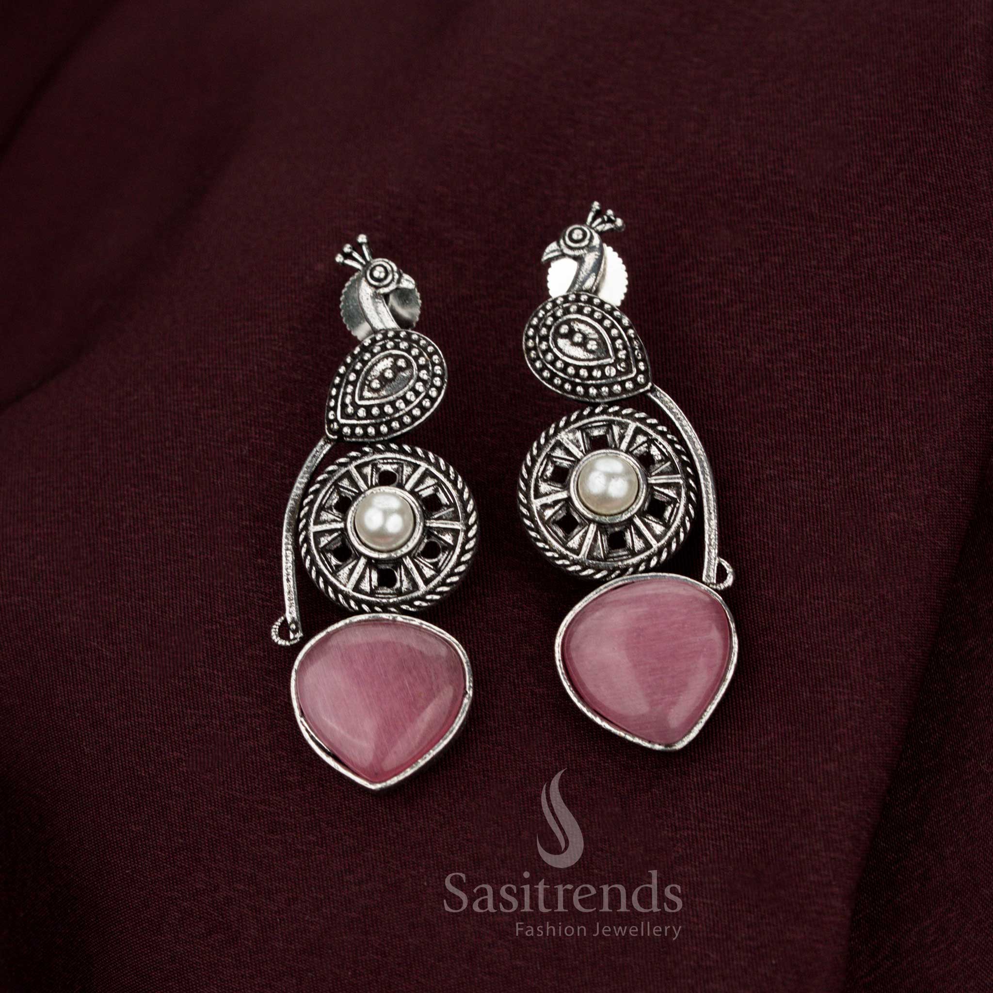 Divine pink oxidised peacock earrings showcasing splendid detailing crafted with pearl drops ideal for opulent Navarathri charm noble elegance and aristocratic jewellery heritage – Sasitrends