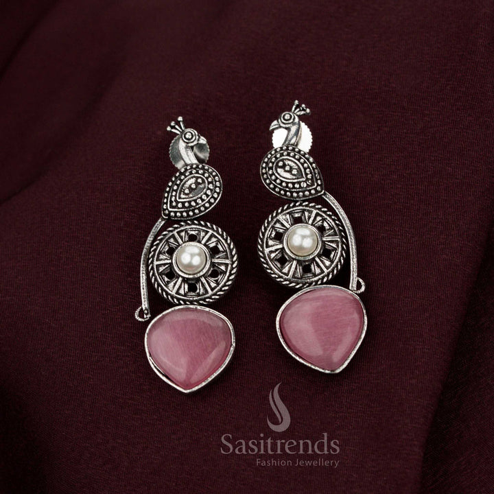 Divine pink oxidised peacock earrings showcasing splendid detailing crafted with pearl drops ideal for opulent Navarathri charm noble elegance and aristocratic jewellery heritage – Sasitrends